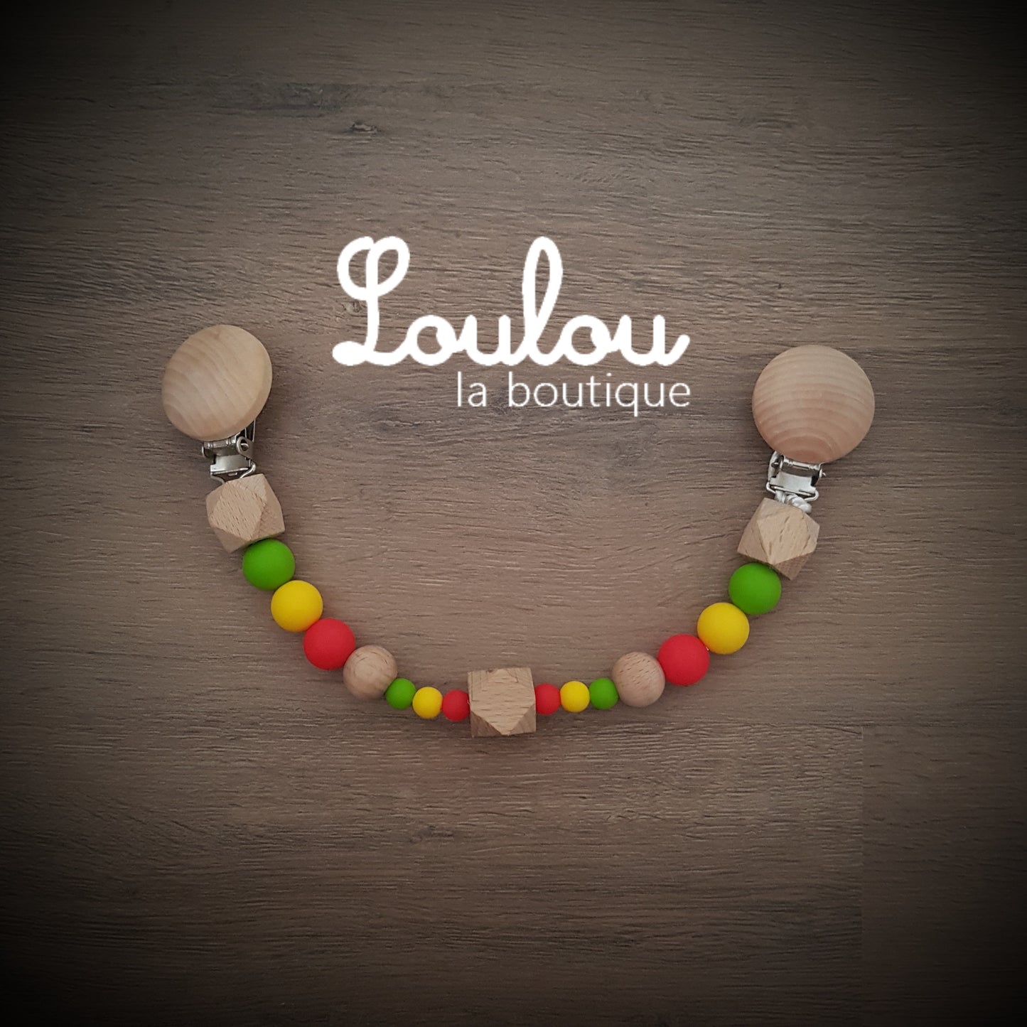 attache doudou attache-doudou Loulou la boutique cadeau naissance éveil dentition accessoire bébé baby shower liste de naissance perle silicone sans BPA bois vert jaune rouge