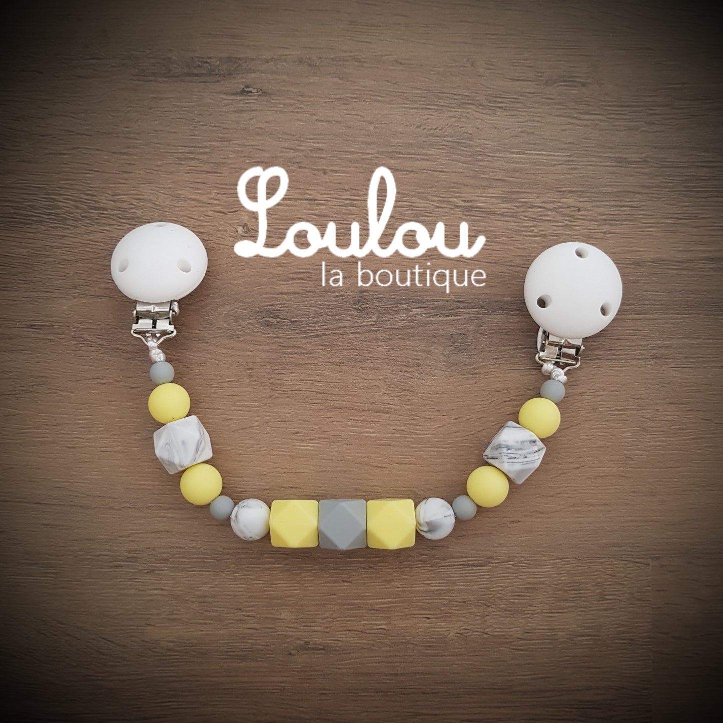 attache doudou attache-doudou Loulou la boutique cadeau naissance éveil dentition accessoire bébé baby shower liste de naissance perle silicone sans BPA jaune